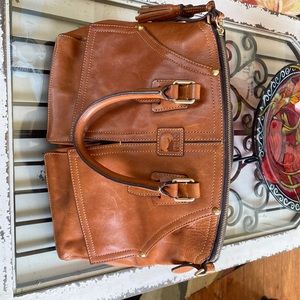 Beautiful Dooney & Bourke classic leather bag with beautiful tassels